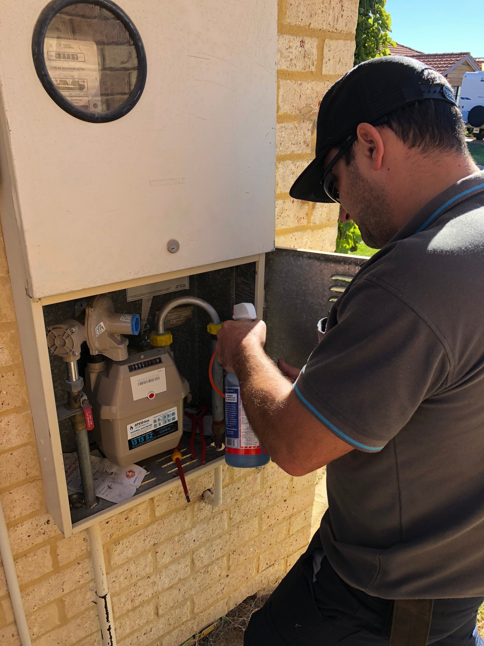 Riverside gas fitter checking the gas meter and fittings at a Perth home