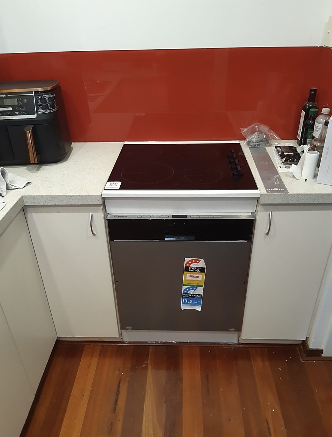 A new electric cooktop and underbench appliance installed in a Perth kitchen