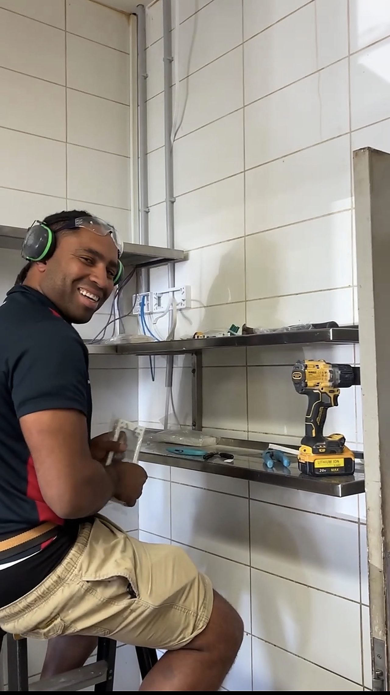 A Riverside electrician installing power points during a kitchen fit-out