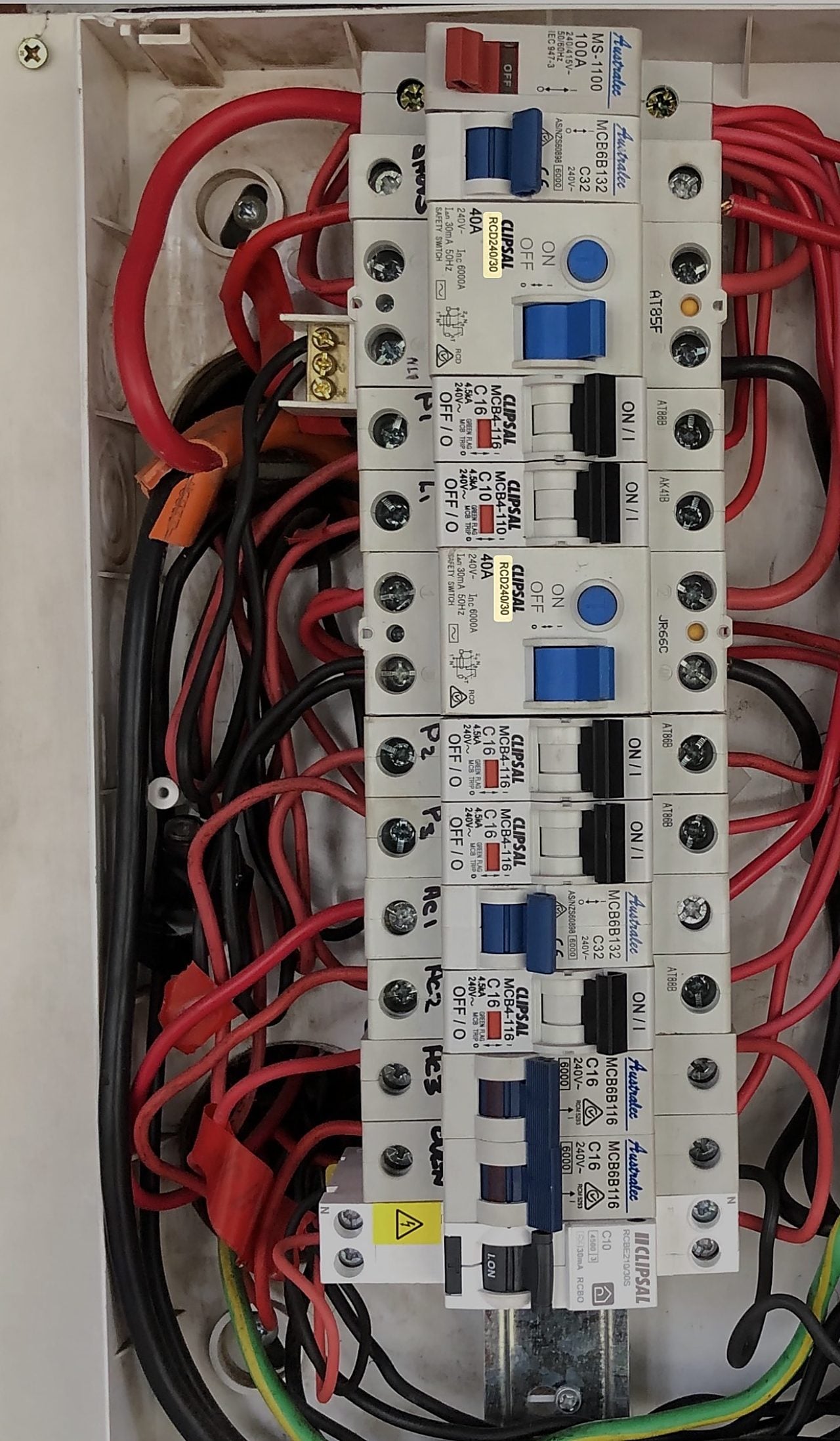 A safety switch (RCD) with its test button on a home switchboard