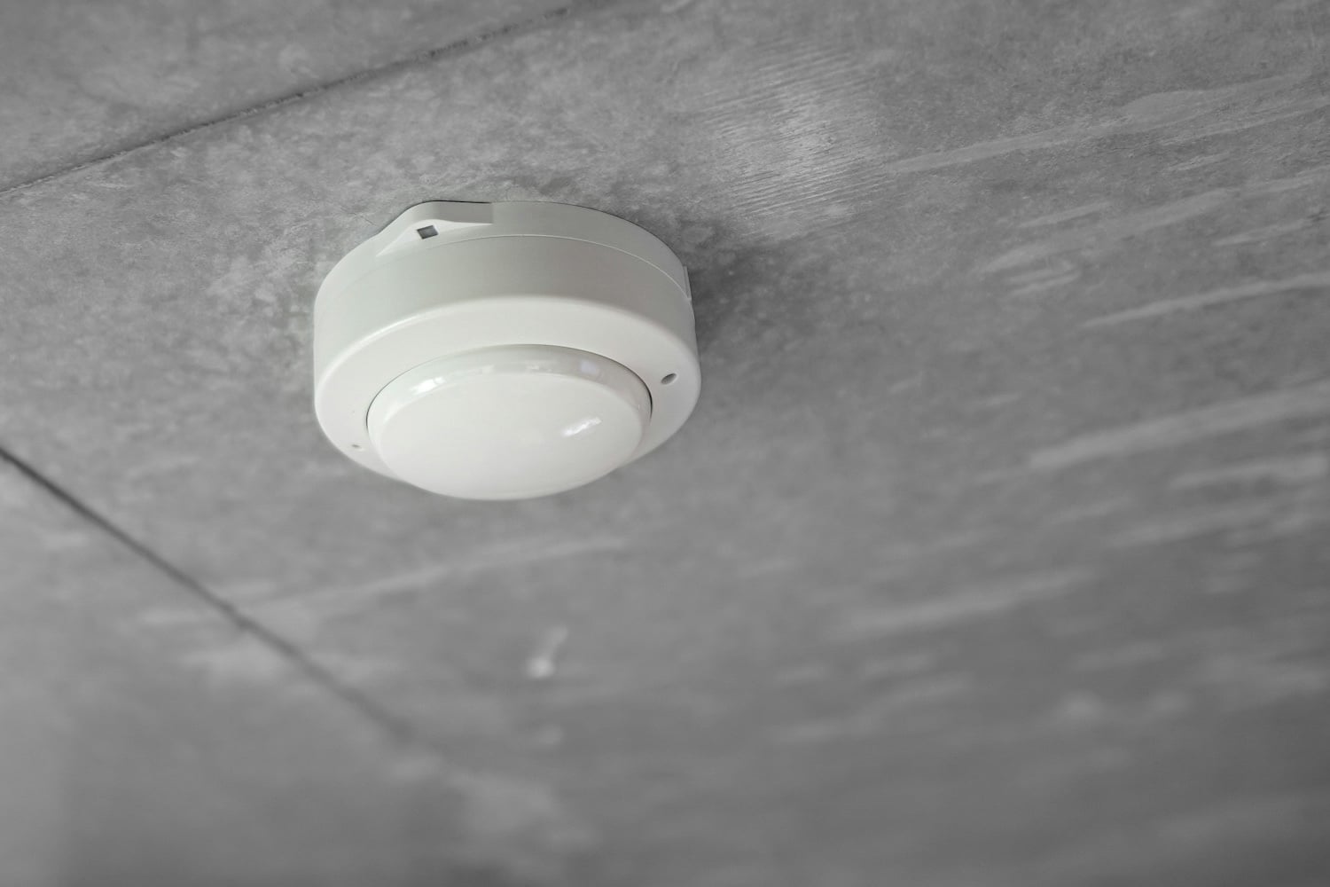 Photoelectric smoke alarm mounted on a ceiling in a Perth home
